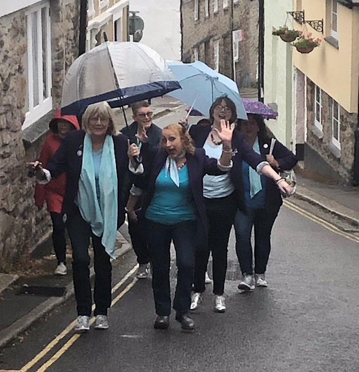 More Harmony in the rain as the women's choir make their way to a performance in Cornwall