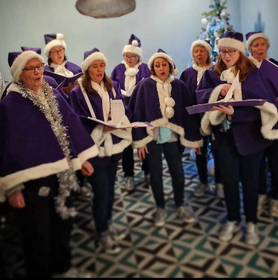 More Harmony choir in their Christmas outfits, performing in Wadebridge