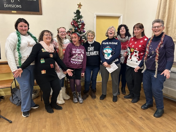 More Harmony members showing off their Christmas jumpers