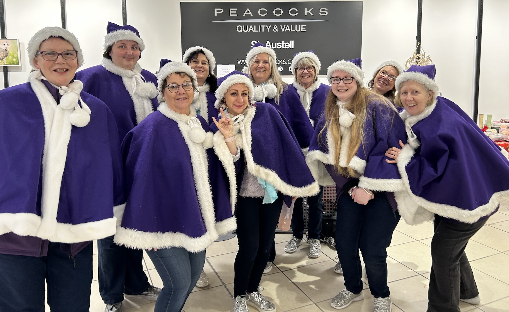 More Harmony pose in their Christmas outfits after singing for Tanya's Courage