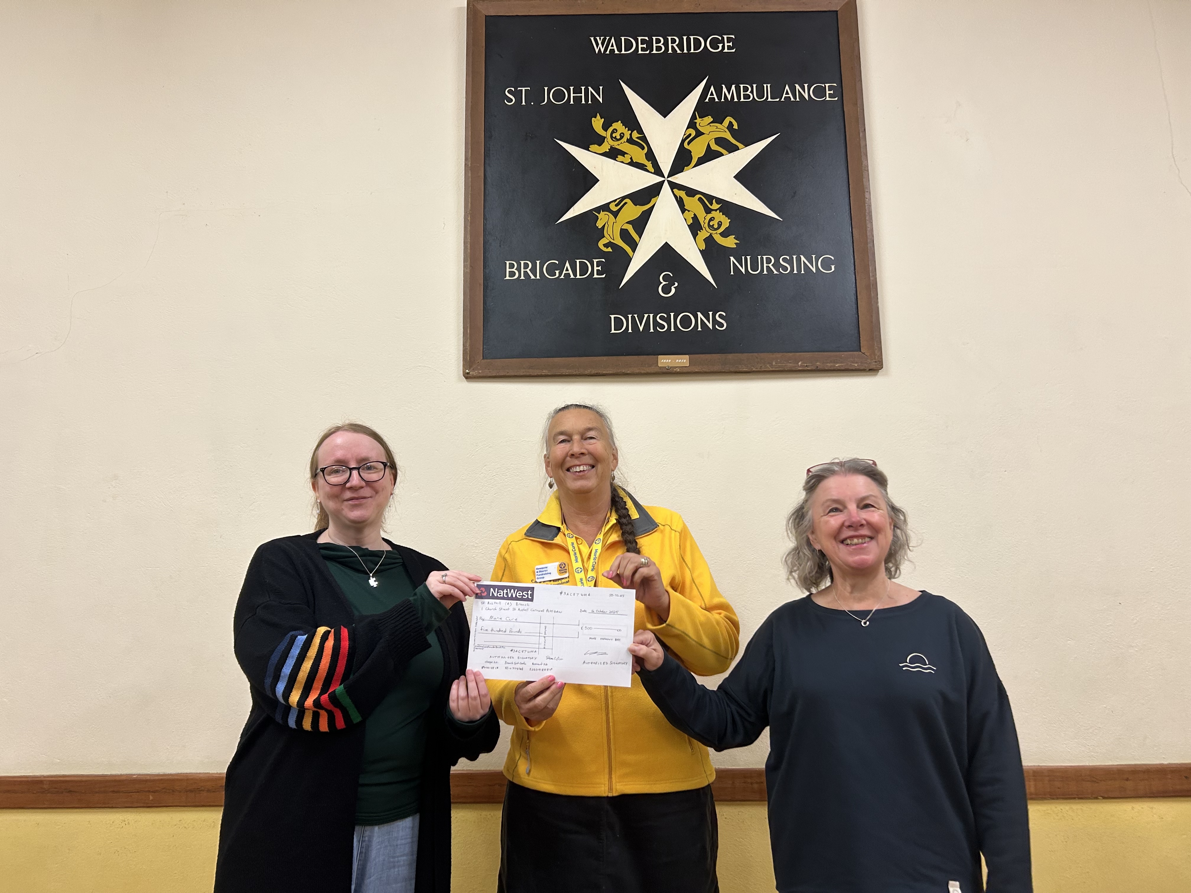 MD Lesley and Chair Person Sue had over a cheque to Marianne from Marie Curie
