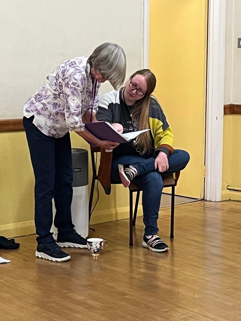 Our baritone section leader having a conversation with our Musical Director at our rehearsal venue, Wadebridge Ambulance Hall, North Cornwall