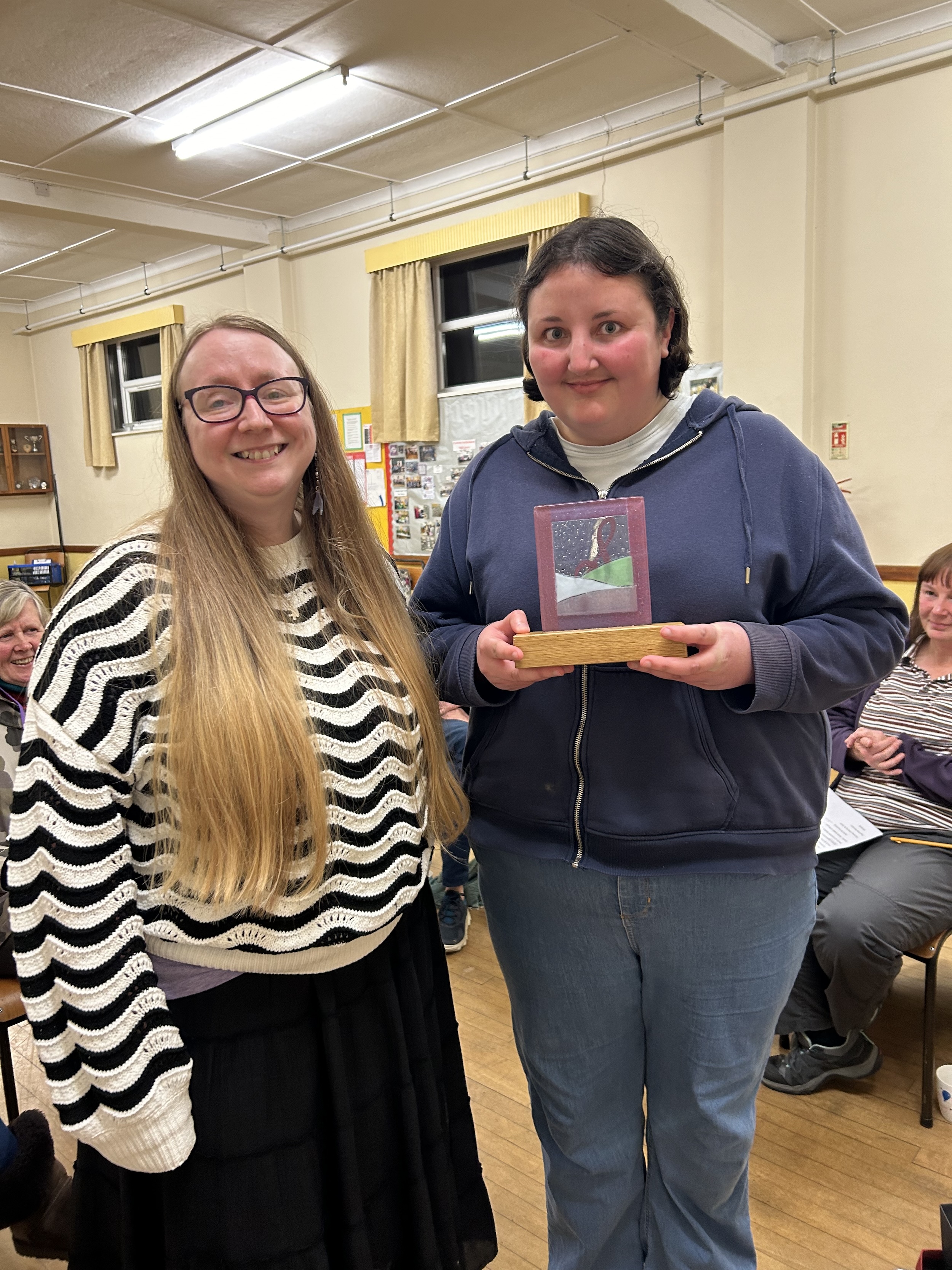 Lesley poses with Alice, who is holding her award